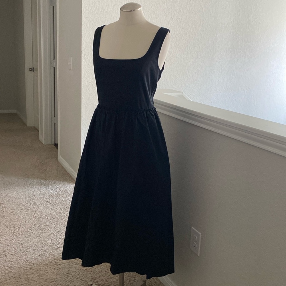 Beautiful simple black dress by the brand a new day it’s a size medium.